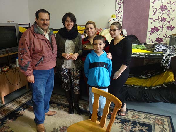 refugee family from Syria who collaborated baking bread